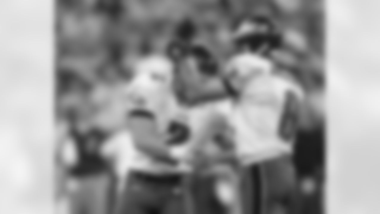 A celebratory exchange between K David Akers and P Dirk Johnson following PAT