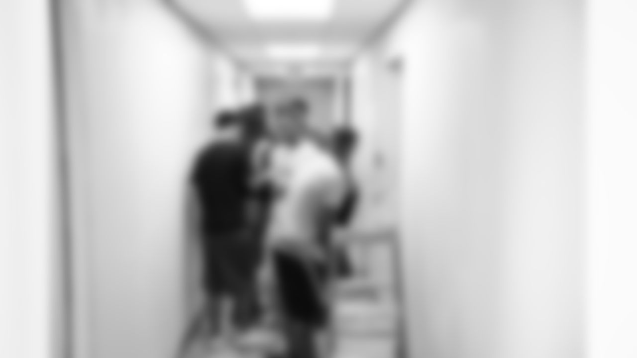 Some of the teens at Summer Search prep the hallway for painting.