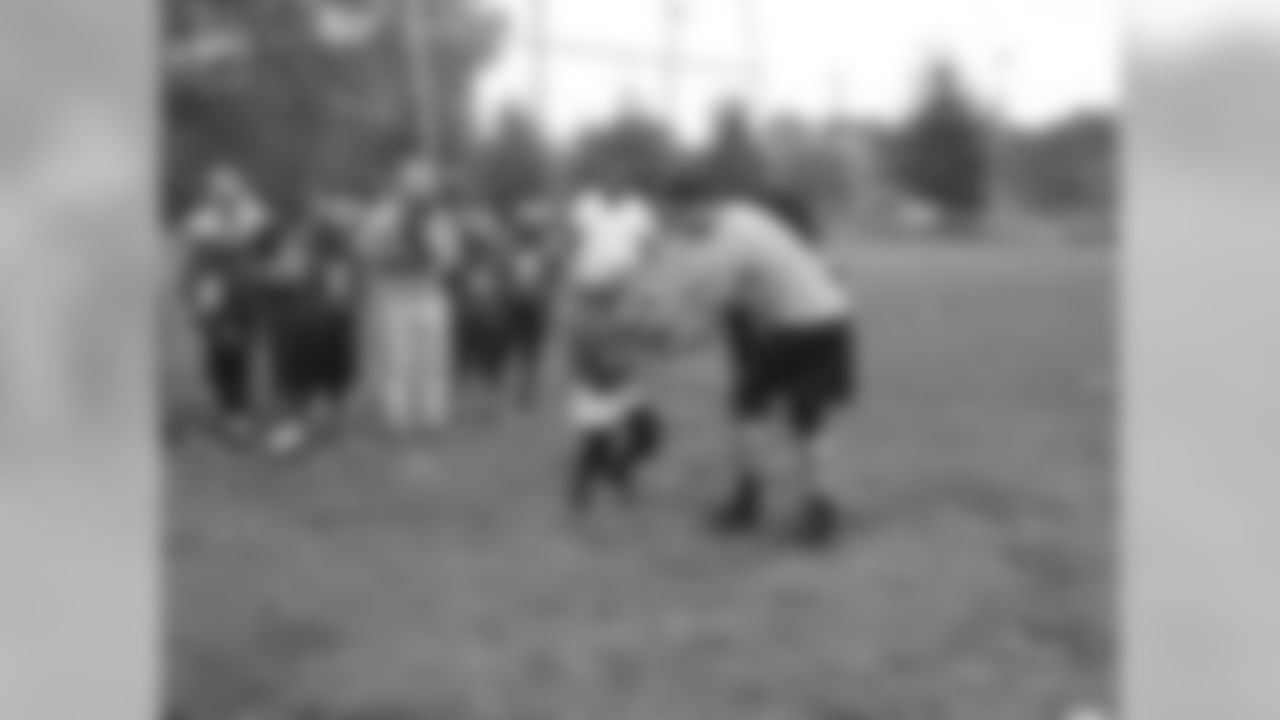 QB Mark Sanchez hands the ball off