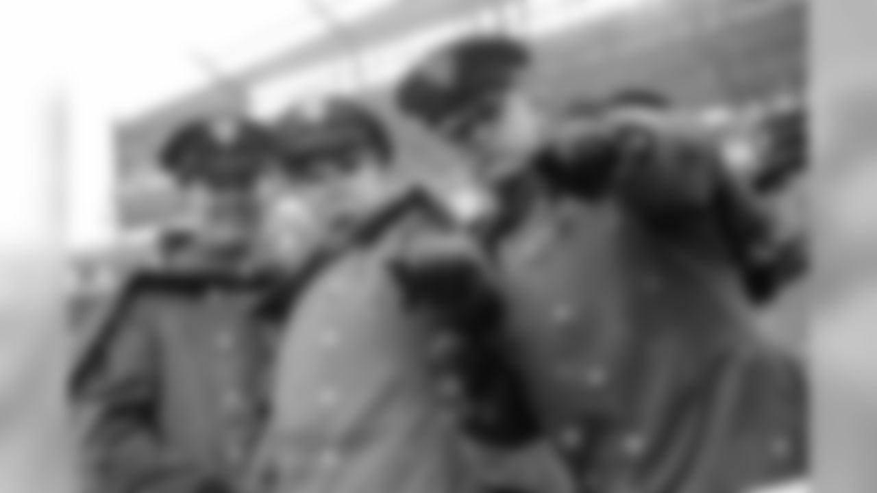 A few Army cadets cheer on their team.