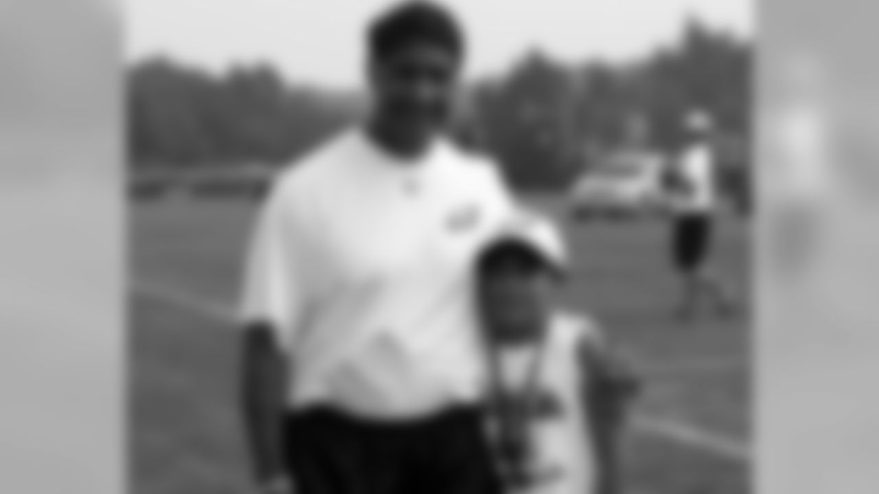 Offensive line coach Juan Castillo with his son