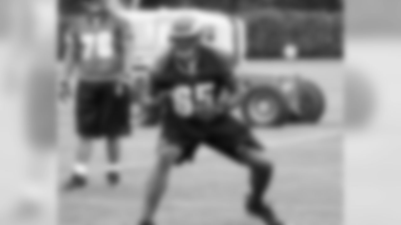 Second-year OT King Dunlap runs through his pass-block technique