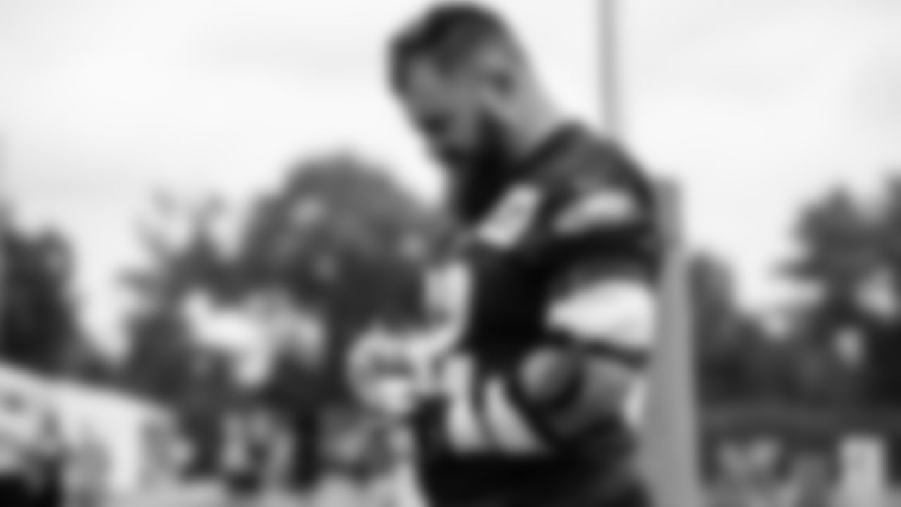 C Jason Kelce signs an autograph after practice