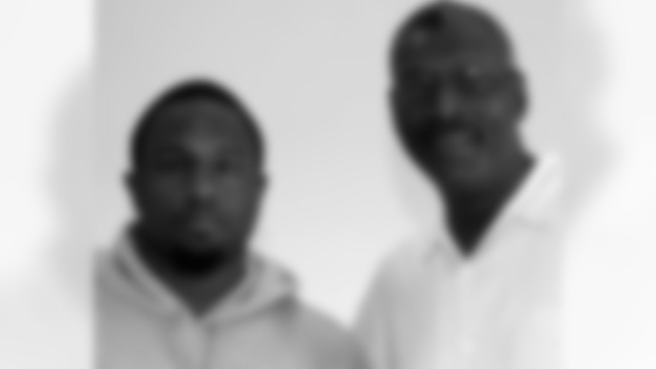 Rookie RB Tony Hunt poses with Director of Player Programs Harold Carmichael