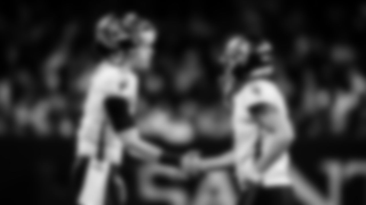 Atlanta Falcons quarterback Desmond Ridder #4 and Atlanta Falcons kicker Younghoe Koo #7 high five during the game against the New Orleans Saints at Caesars Superdome in New Orleans, Louisiana on Sunday, December 18, 2022. (Photo by Shanna Lockwood/Atlanta Falcons)