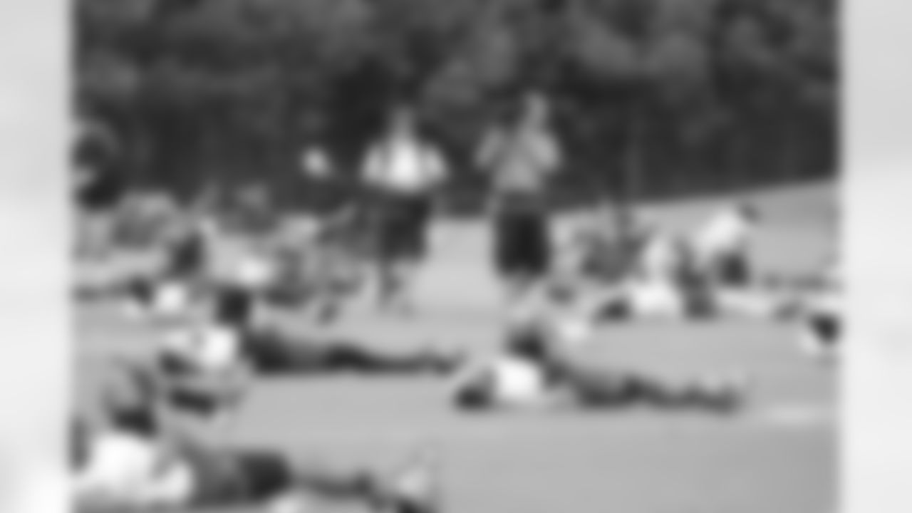 HBO's 'Hard Knocks' crew walks through the players stretching lines