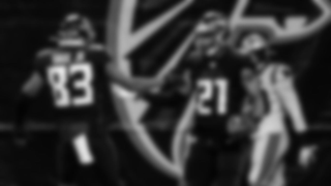 Atlanta Falcons running back Todd Gurley II #21 celebrates scoring a touchdown with wide receiver Russell Gage #83 against the Carolina Panthers on October 11, 2020. (Photo by Rob Foldy/Atlanta Falcons)