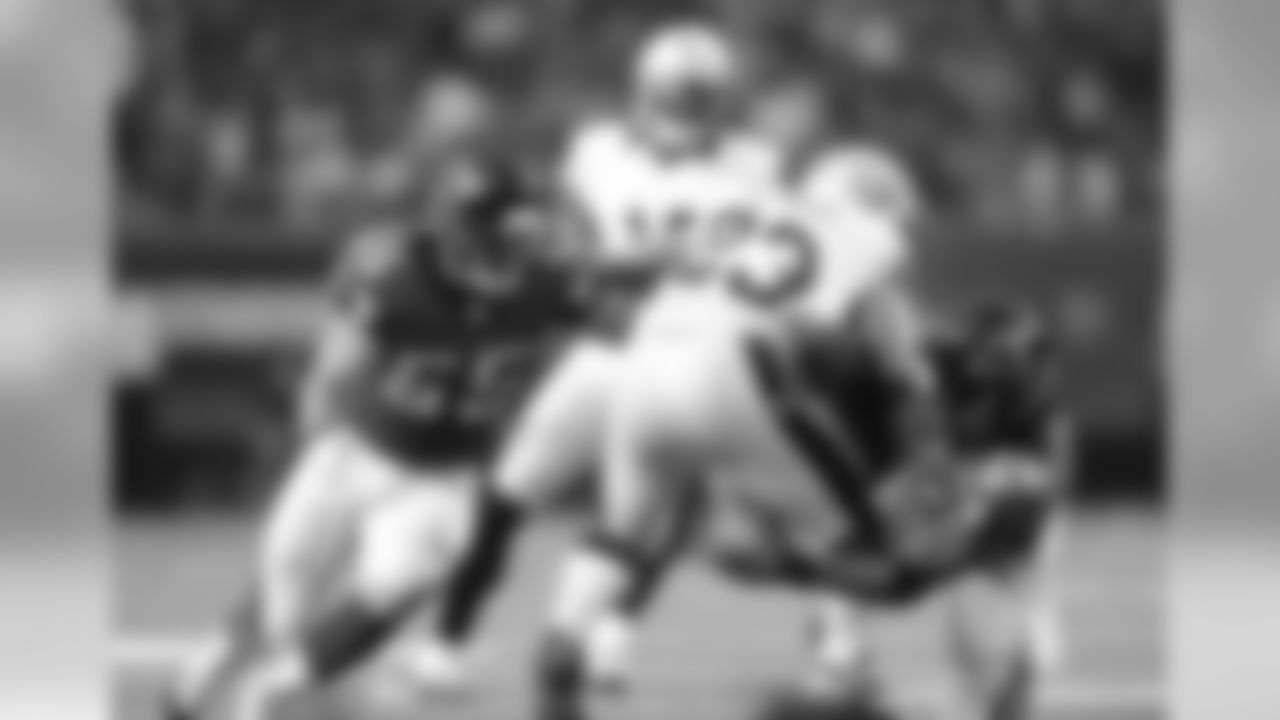 LB Paul Worrilow and FS Dwight Lowery combine for a tackle.