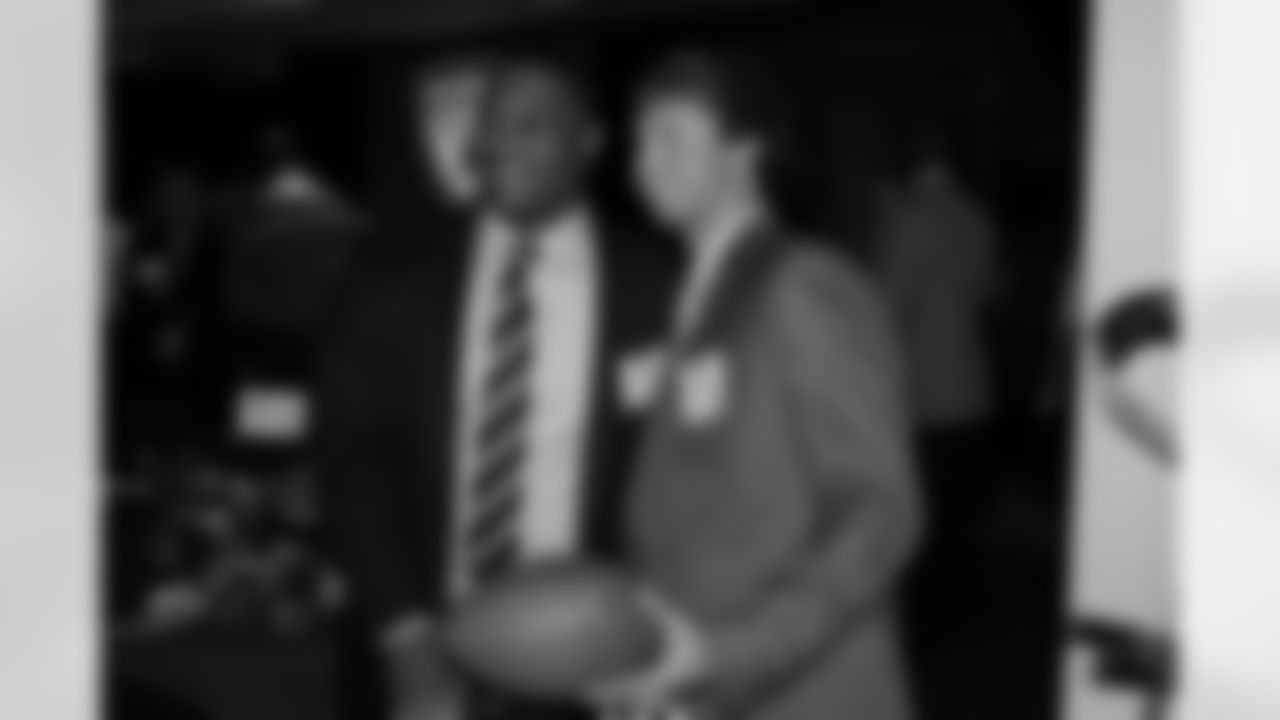 Defensive tackle Corey Peters poses with a fan // Rookie Club Dinner - 2012 // May 29, 2012 // Atlanta -