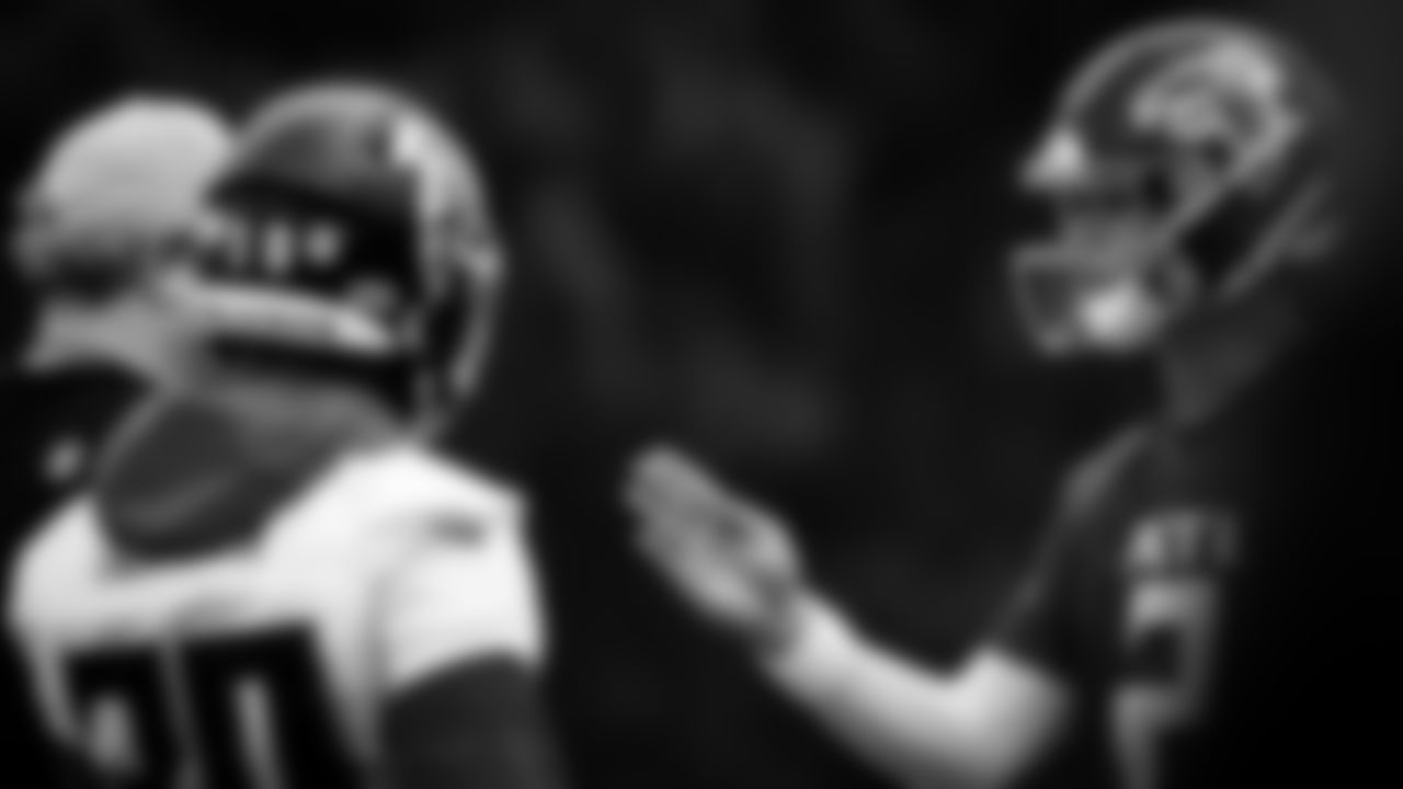 Atlanta Falcons quarterback Matt Ryan #2 talks with Atlanta Falcons head coach Arthur Smith and running back Qadree Ollison #30 during organized team activities in Phase III of the Atlanta Falcons offseason program on June 2, 2021.