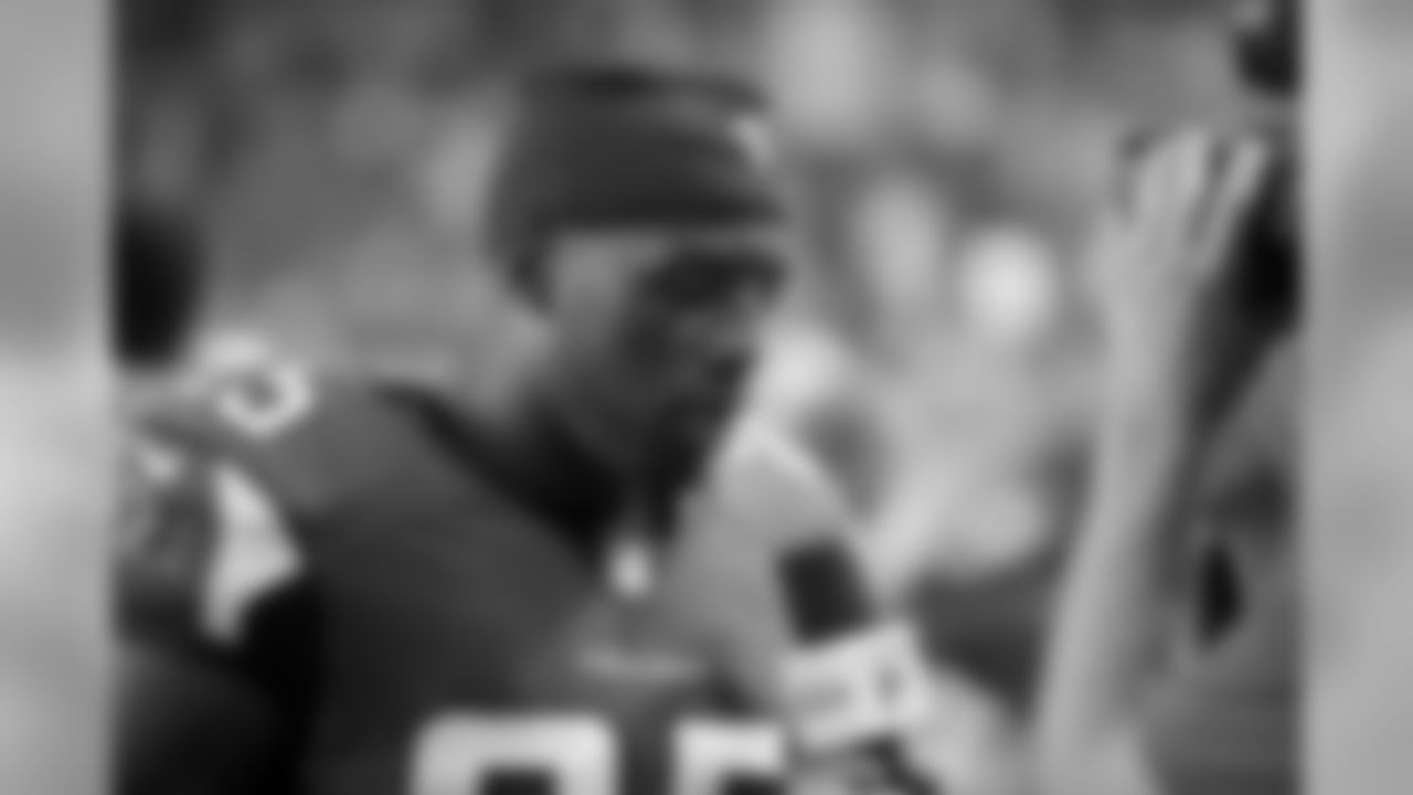S William Moore is interviewed by a reporter during the game.
