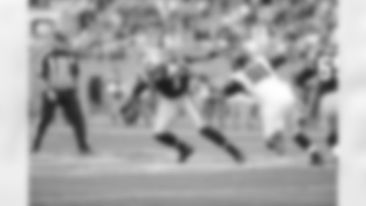 DT Corey Peters gets pressure on Panthers QB Cam Newton