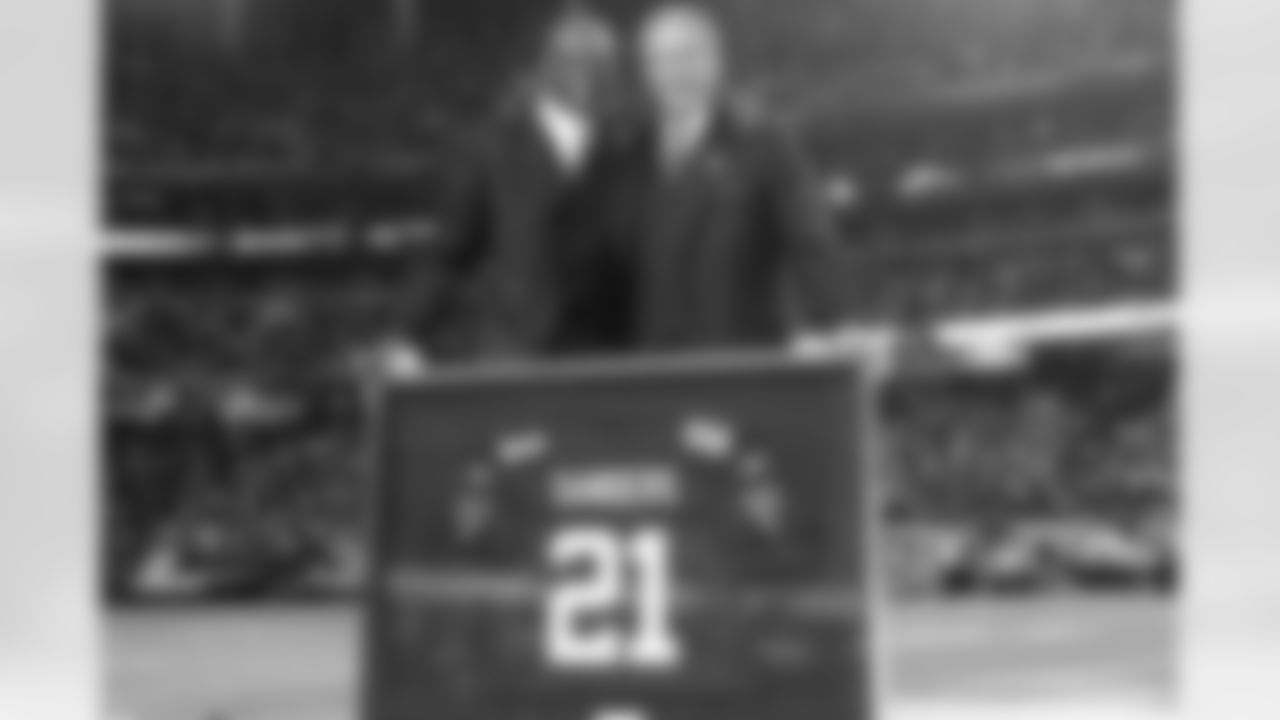 Owner Arthur Blank poses with Deion Sanders and the Ring of Honor inductee's #21 Falcons jersey. // Falcons vs Ravens // 11/11/10 - Georgia Dome