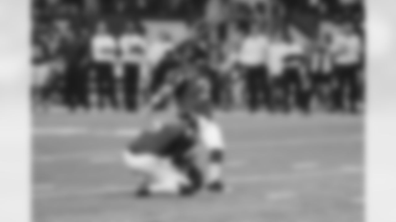 January 13, 2013: Holder Matt Bryant takes the perfect snap and places the ball on the ground. Bryant takes a swipe at it and gets all of it...