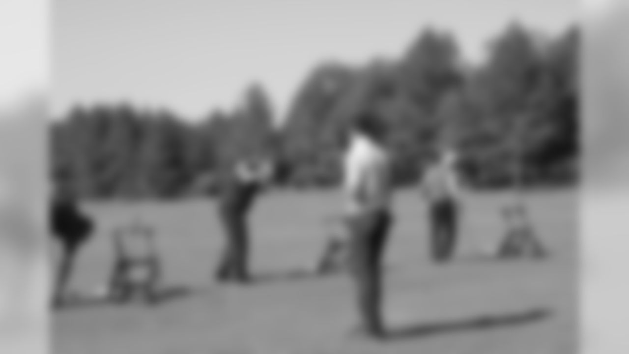 Matt Ryan watches offensive coordinator Dirk Koetter on the driving range