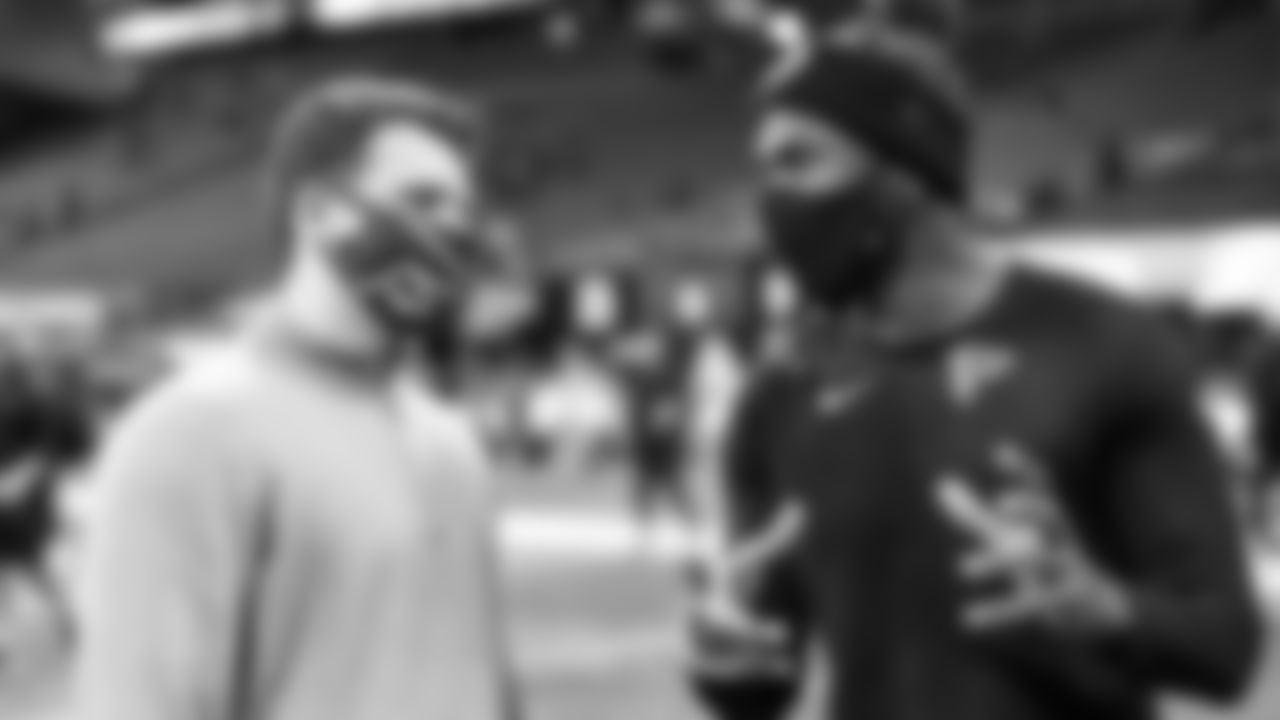 Atlanta Falcons wide receiver Julio Jones #11 talks to Josh Blank during pregame against the Tampa Bay Buccaneers on December 20, 2020.