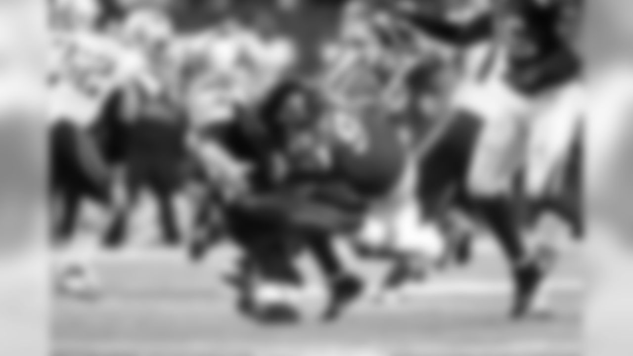 DT Jonathan Babineaux gets a hit in on Patriots QB Tom Brady