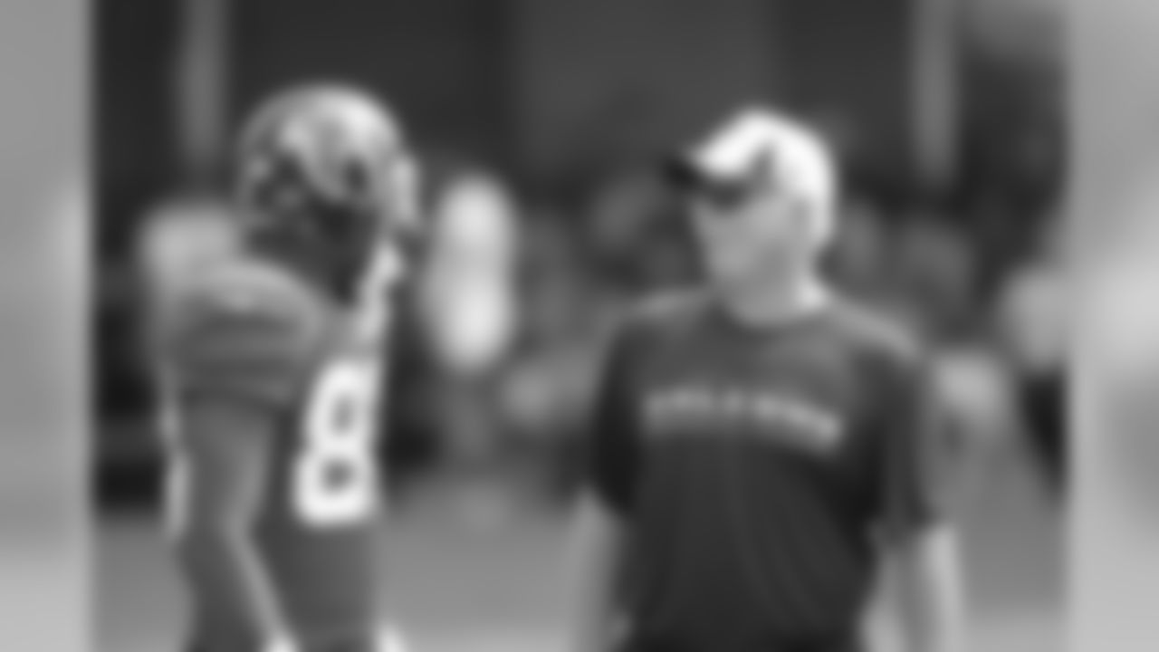 WR Harry Douglas chats with head coach Mike Smith