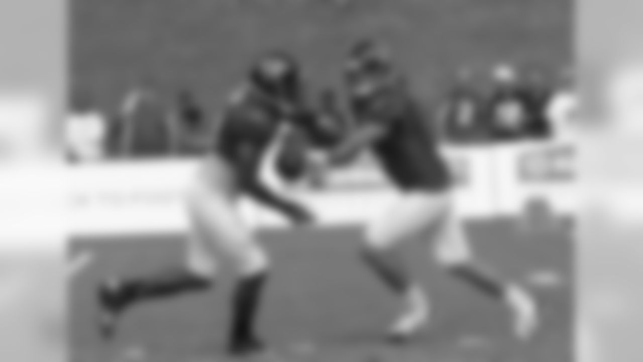 QB Seth Doege hands off the ball during a drill