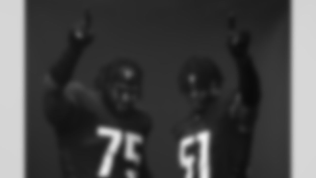 Atlanta Falcons edge DeAngelo Malone #51 and guard Justin Shaffer #75 pose during 2022 Creative Day at CW Davis Middle School in Flowery Branch, GA, on June 13, 2022. (Photo by Shanna Lockwood/Atlanta Falcons)