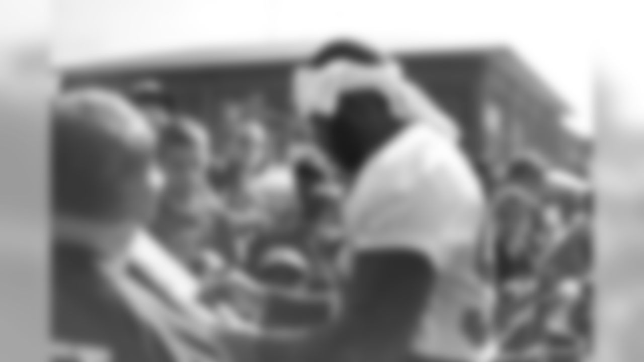 Defensive end John Abraham mingles with fans // 2012 Atlanta Falcons Minicamp - Day 2 // June 20, 2012 // Flowery Branch, Ga. -