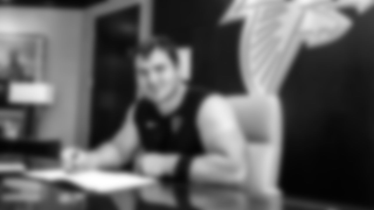 Atlanta Falcons offensive lineman Drew Dalman #67 signing his contract to become an Atlanta Falcon on June 17, 2021 in Flowery Branch, GA.