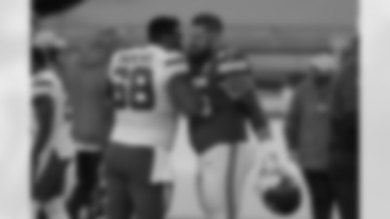 New York Jets' Josh Andrews (68) and Kansas City Chiefs' Mike Remmers (75) greet each other after their NFL football game on Sunday, Nov. 1, 2020, in Kansas City, Mo. (AP Photo/Charlie Riedel)