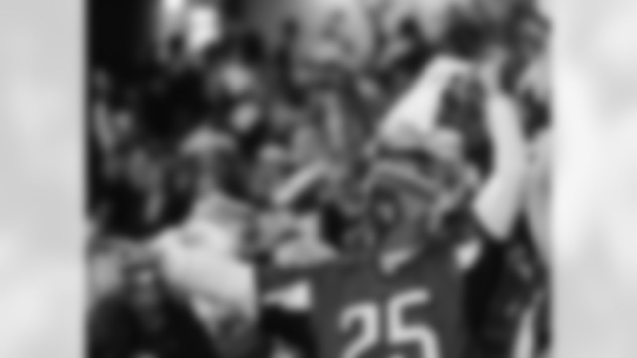 Falcons fan cheers from the sidelines