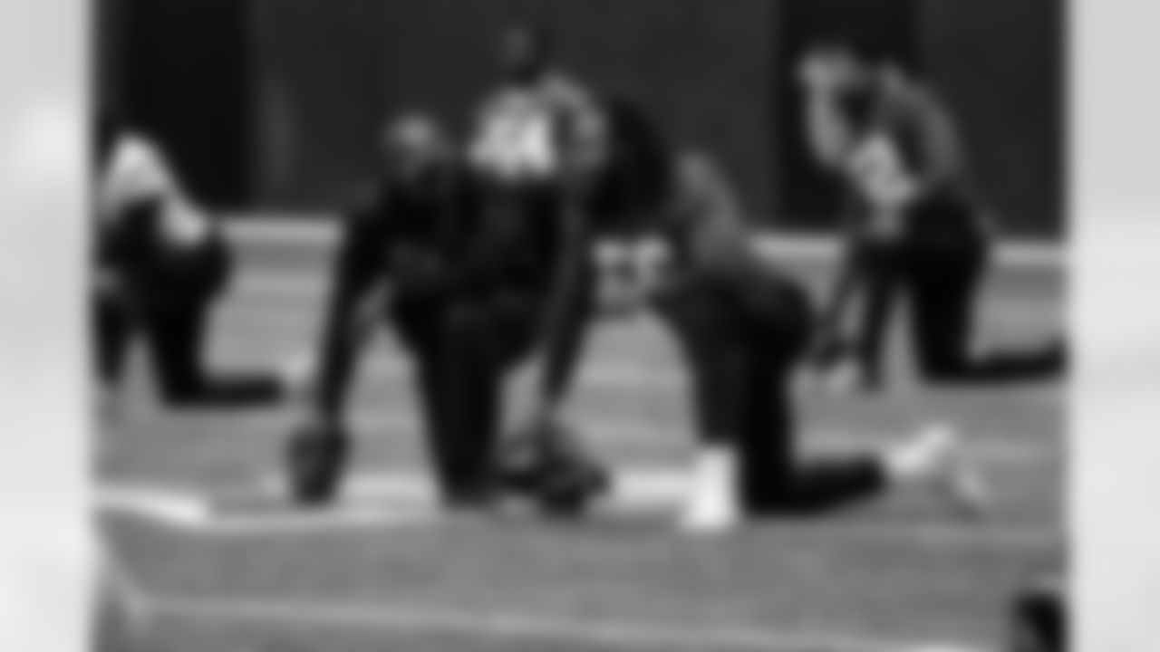 Marquand Manuel, defensive coordinator, DE Steven Means