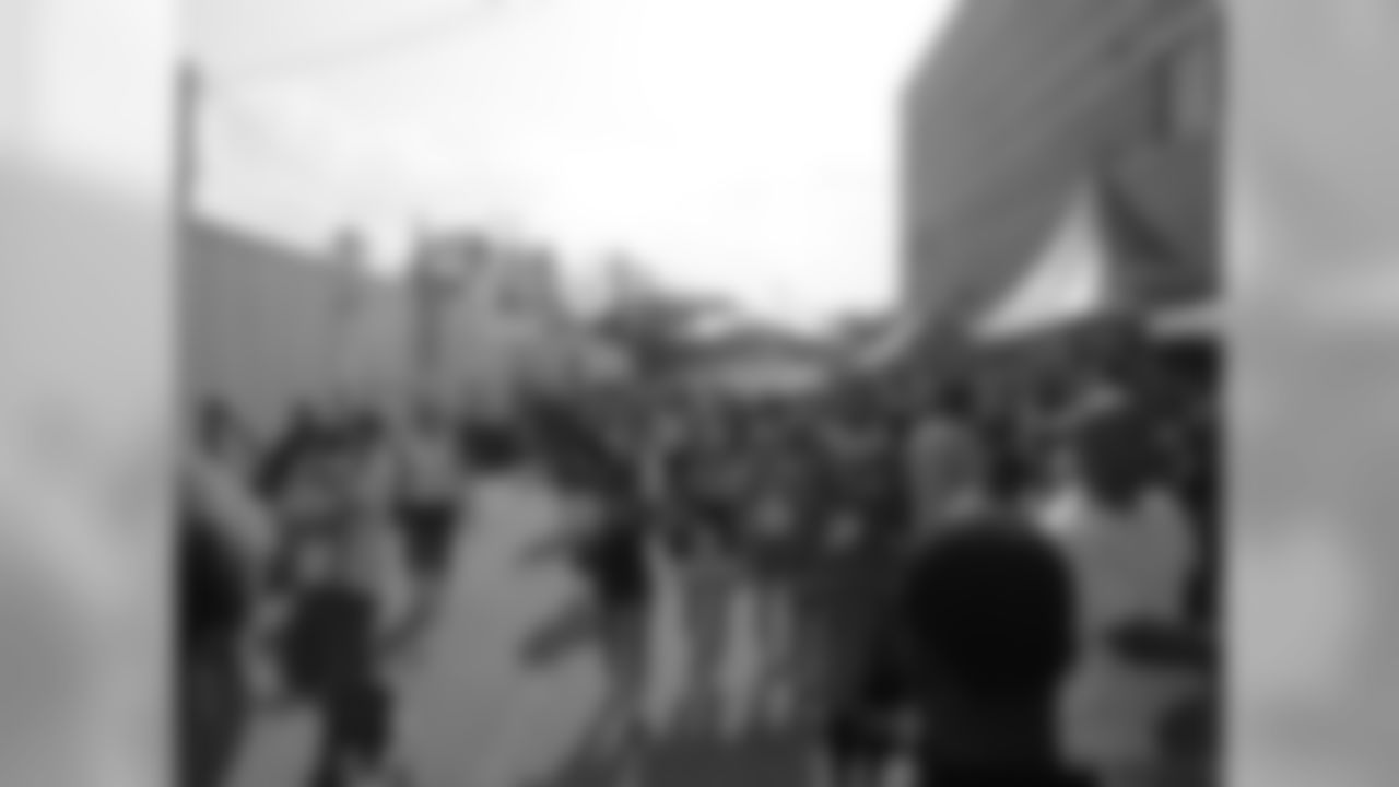 Fans make their way past the corporate partner tents. // 2011 Friday Night Lights // August 5, 2011 // Norcross, Ga. —