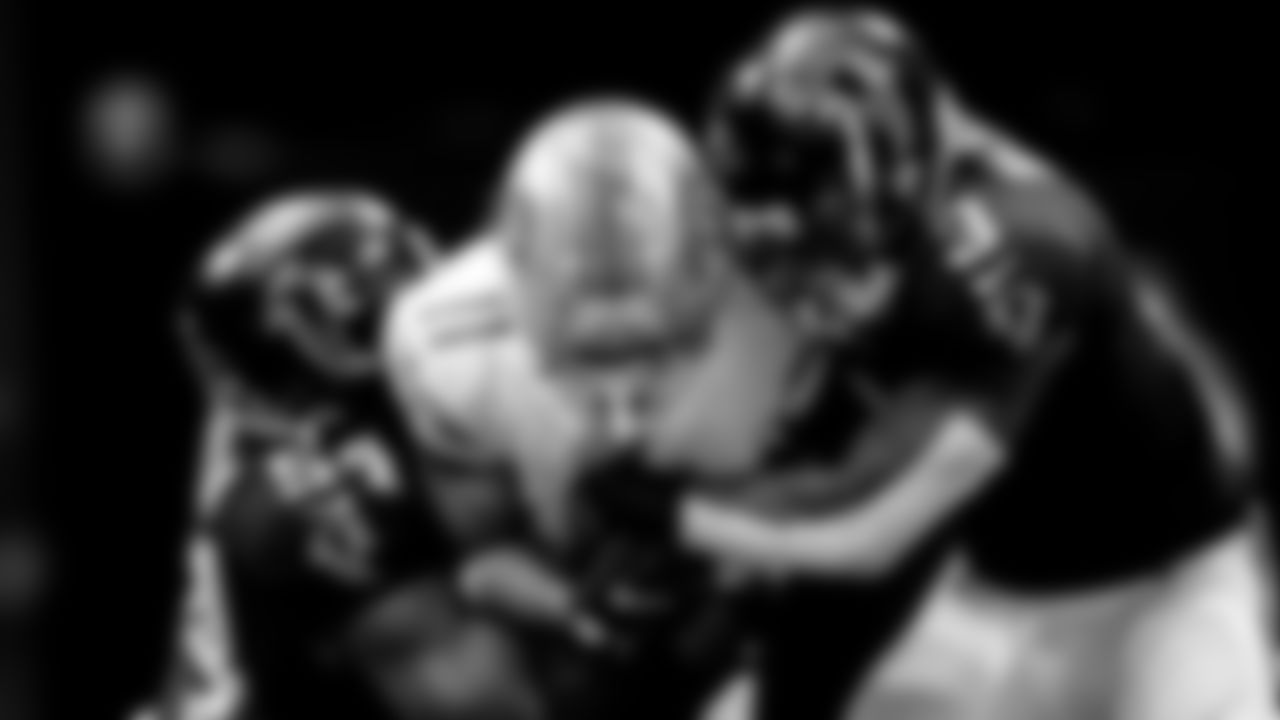 Atlanta Falcons linebacker Foye Oluokun #54 and linebacker Mykal Walker #3 make a tackle against the Detroit Lions at Mercedes-Benz Stadium in Atlanta, Georgia on Sunday, December 26, 2021. (Photo by Shanna Lockwood/Atlanta Falcons)