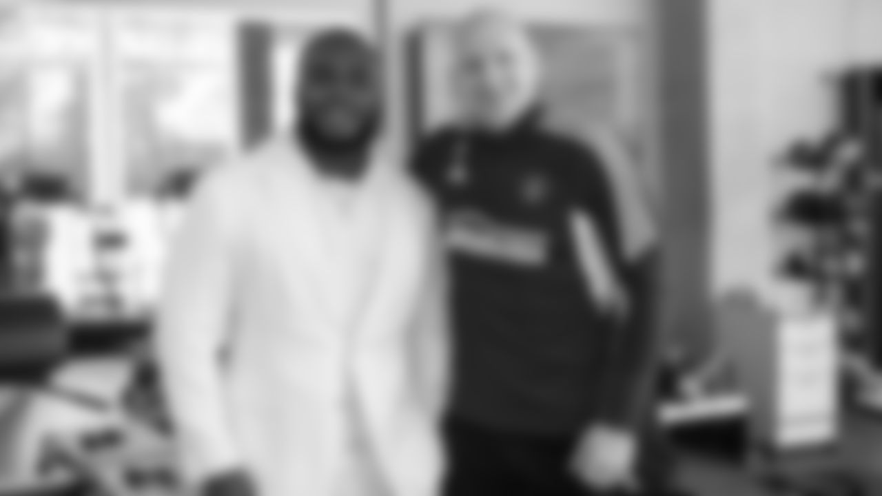 Atlanta Falcons defensive lineman Grady Jarrett #97 greets Brad Guzan as he visits Atlanta United Training Ground in Marietta, Georgia, on Tuesday, April 11, 2023. (Photo by Shanna Lockwood/Atlanta Falcons)