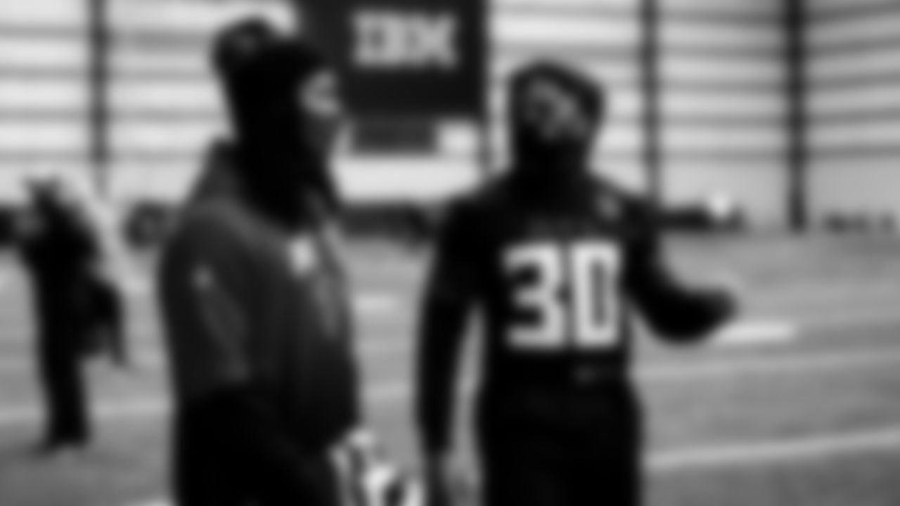 Atlanta Falcons running back Todd Gurley #21 talks to running back Qadree Ollison #30 during practice in the indoor facility at IBM Performance Field.