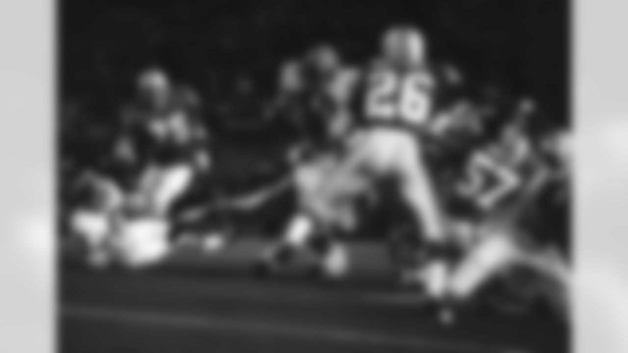 Paul Gibson, of the Falcons, goes through the middle of the Dolphin line for a 7-yard gain on September 12, 1970