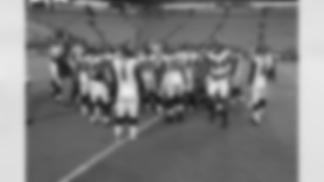 The Falcons huddle up before the game begins // Falcons at Dolphins - 2012