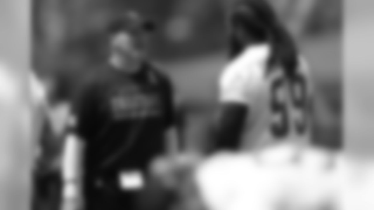 Head coach Dan Quinn chats with DE Adrian Clayborn