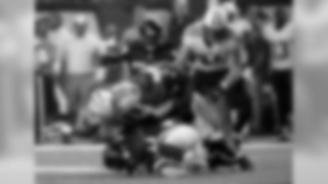 DE Stansly Maponga and CB Robert McClain team up to tackle Titans' RB Bishop Sankey