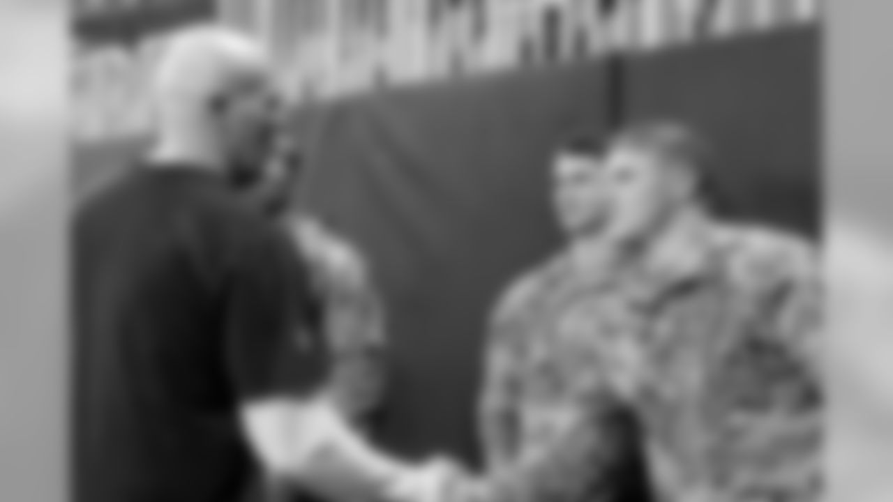 Atlanta Falcons head coach Dan Quinn meets with military members before the game between the Atlanta Falcons and the Tampa Bay Buccaneers at Mercedes-Benz Stadium in Atlanta, GA, on Sunday November 24, 2019. (Photo by Adler Garfield/Atlanta Falcons)