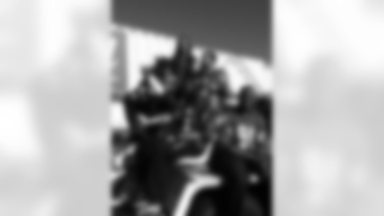 Several Falcons and cheerleaders pose outside a jetway at Hartsfield-Jackson Atlanta Airport // Trading Places - AirTran // Nov. 1, 2011 // Atlanta -