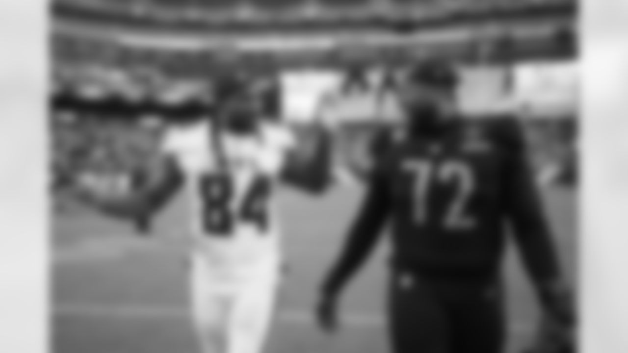 Atlanta Falcons running back Cordarrelle Patterson #84 talks with Washington Commanders offensive tackle Charles Leno Jr. #72 after their game at FedEx Field in North Englewood, Maryland on Sunday, November 27, 2022. (Photo by Mark Brown/Atlanta Falcons)