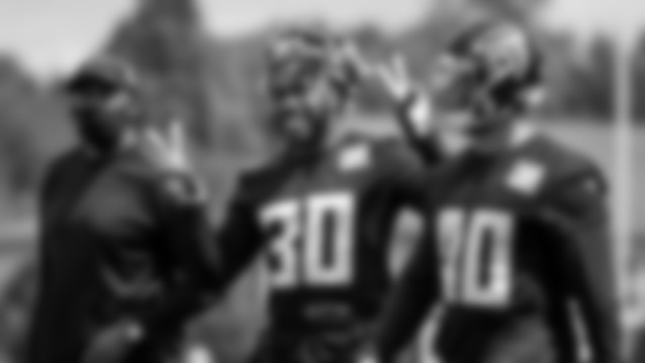 Coach Bernie Parmalee, Atlanta Falcons running back Qadree Ollison #30 and fullback Keith Smith #40 walk together during practice at IBM Performance Field. (Photo by Kara Durrette/Atlanta Falcons)