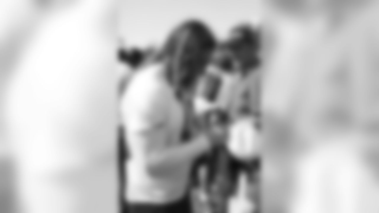 LB Matt Hansen autographs a hat for a fan // 2012 Atlanta Falcons Minicamp - Day 2 // June 20, 2012 // Flowery Branch, Ga. -