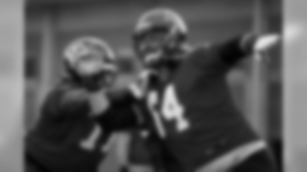 Atlanta Falcons offensive guard James Carpenter #77 works with offensive guard Sean Harlow #64 during practice. (Photo by Kara Durrette/Atlanta Falcons)