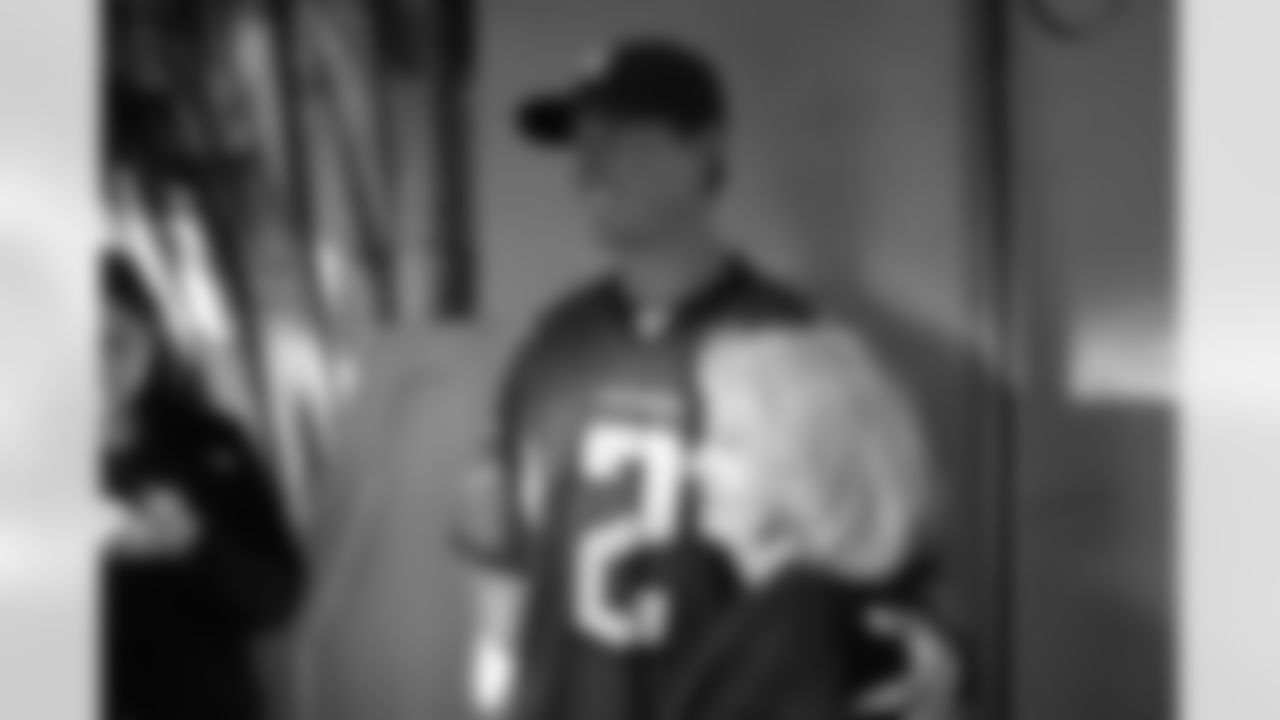 Several Falcons traded places with AirTran workers to marshal planes, take tickets and greet passengers // Trading Places - AirTran // Nov. 1, 2011 // Atlanta -
