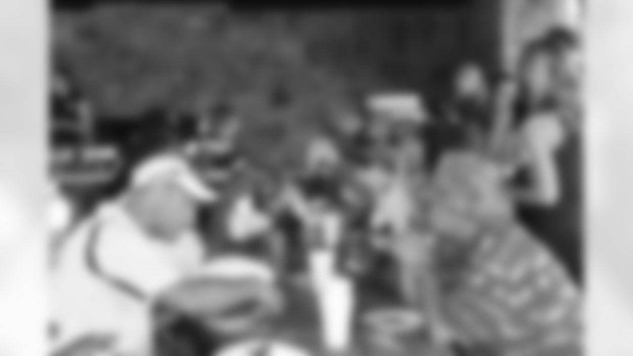 Participants enjoy a barbeque following a full afternoon of fishing