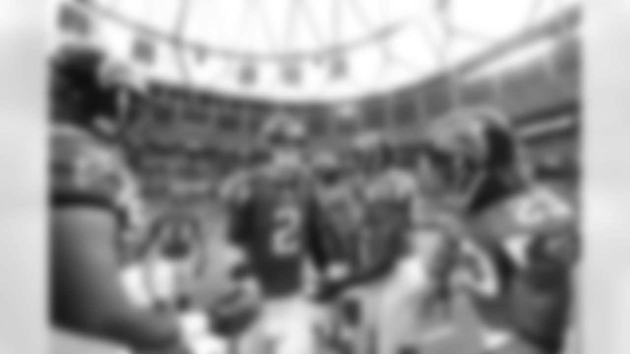 QB Matt Ryan high fives teammates before the game