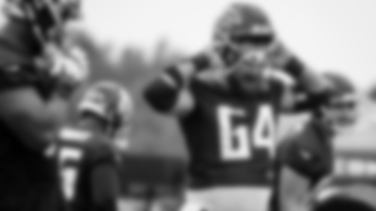 Atlanta Falcons guard Sean Harlow #64 puts on his helmet during practice at IBM Performance Field. (Photo by Kara Durrette/Atlanta Falcons)