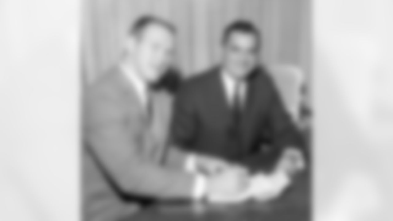 LB Tommy Nobis and Rankin Smith on December 14, 1965