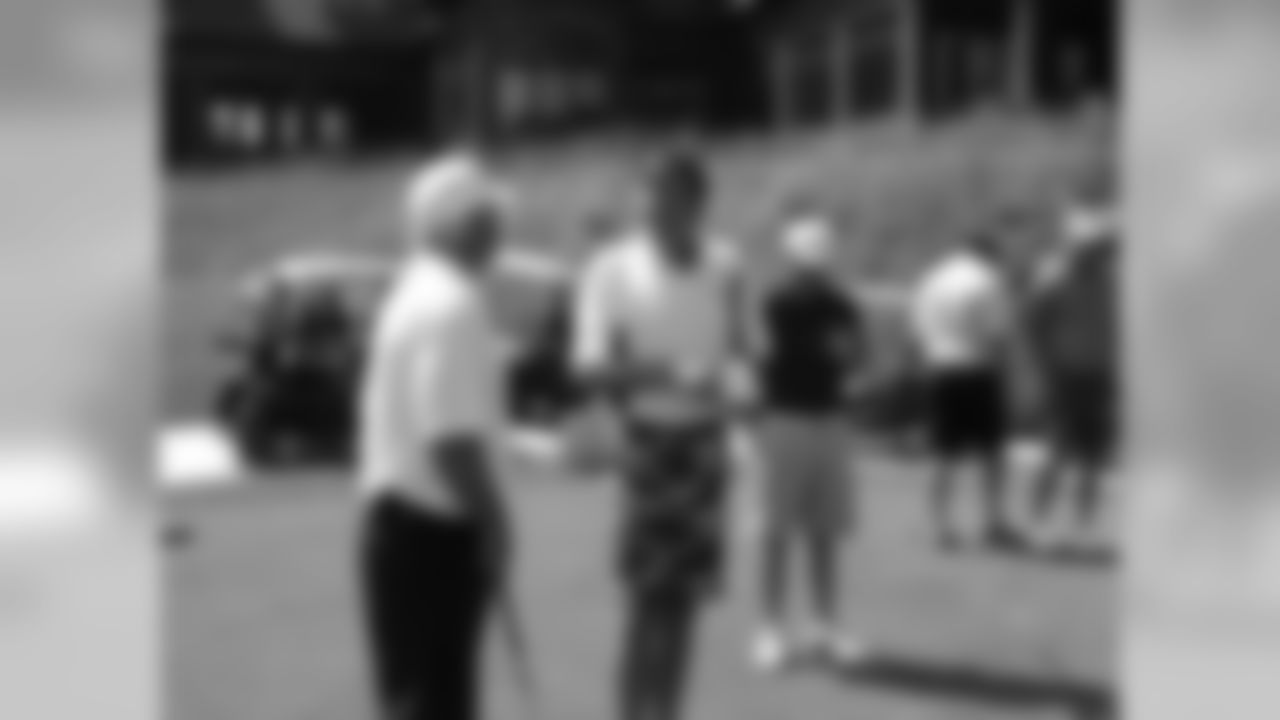 Coach Smith takes in a conversation with TNT's Craig Sager // Seventh Annual Verizon Network of Champions Golf Tournament // 6/13/11 // Suwanee, Ga. -