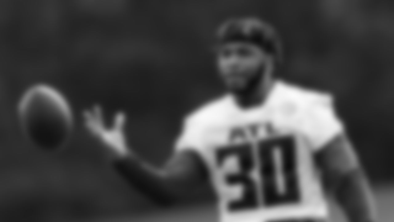 Atlanta Falcons running back Qadree Ollison #30 tosses the football during field work drills in Phase II of the Atlanta Falcons offseason program on May 18, 2021.